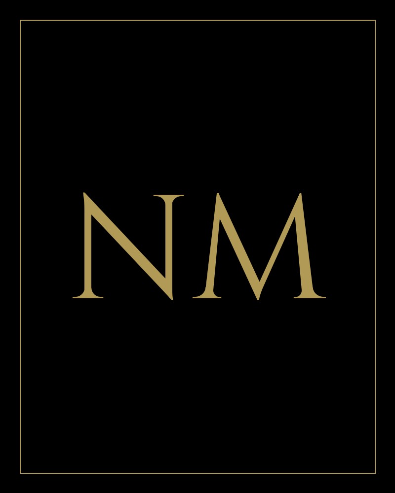 Gold monogram of the initials NM for Noah Martens of The Tackett Team