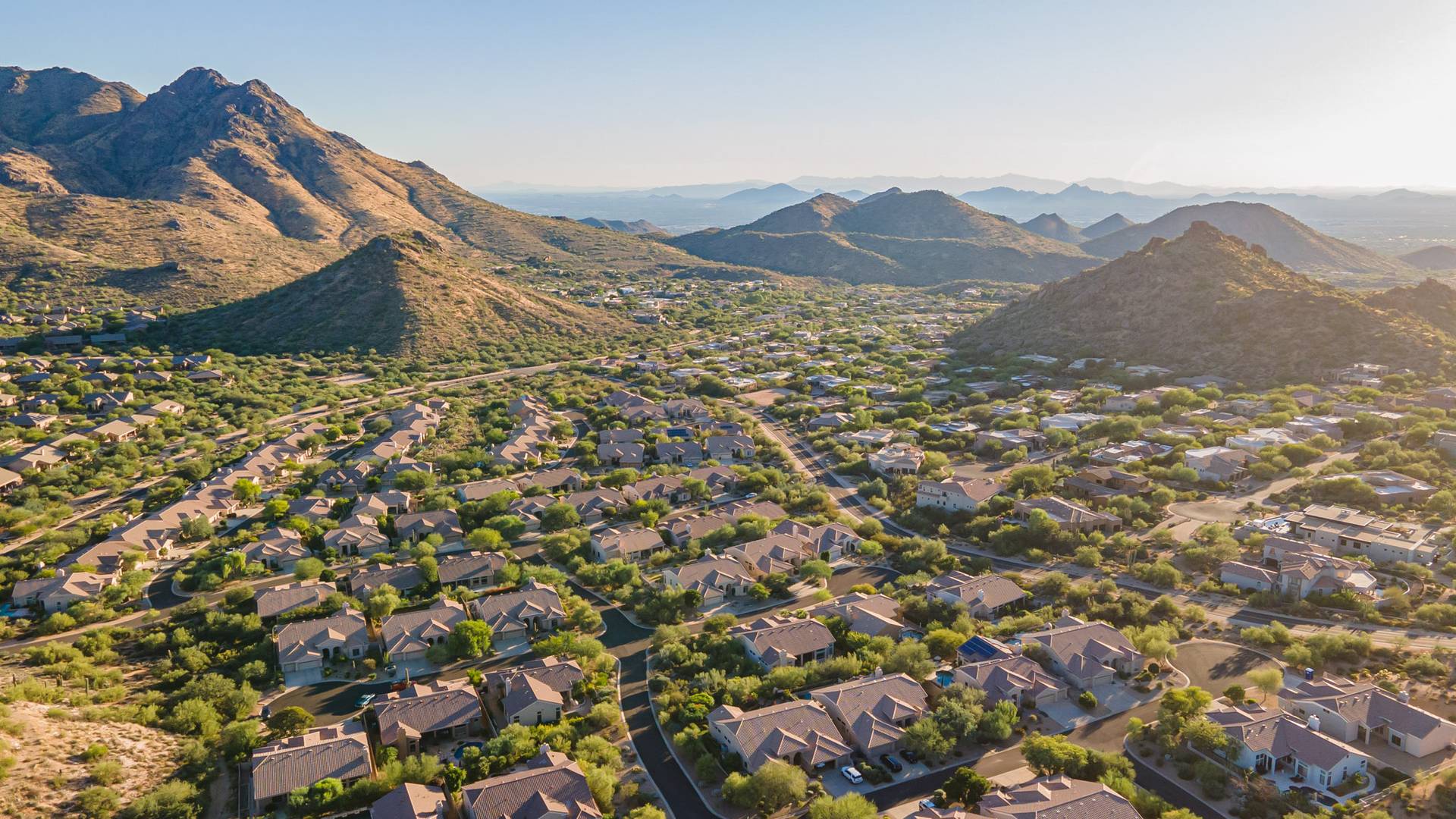 Aerial view of homes beneath the mountains in the Troon foothills, north Scottsdale