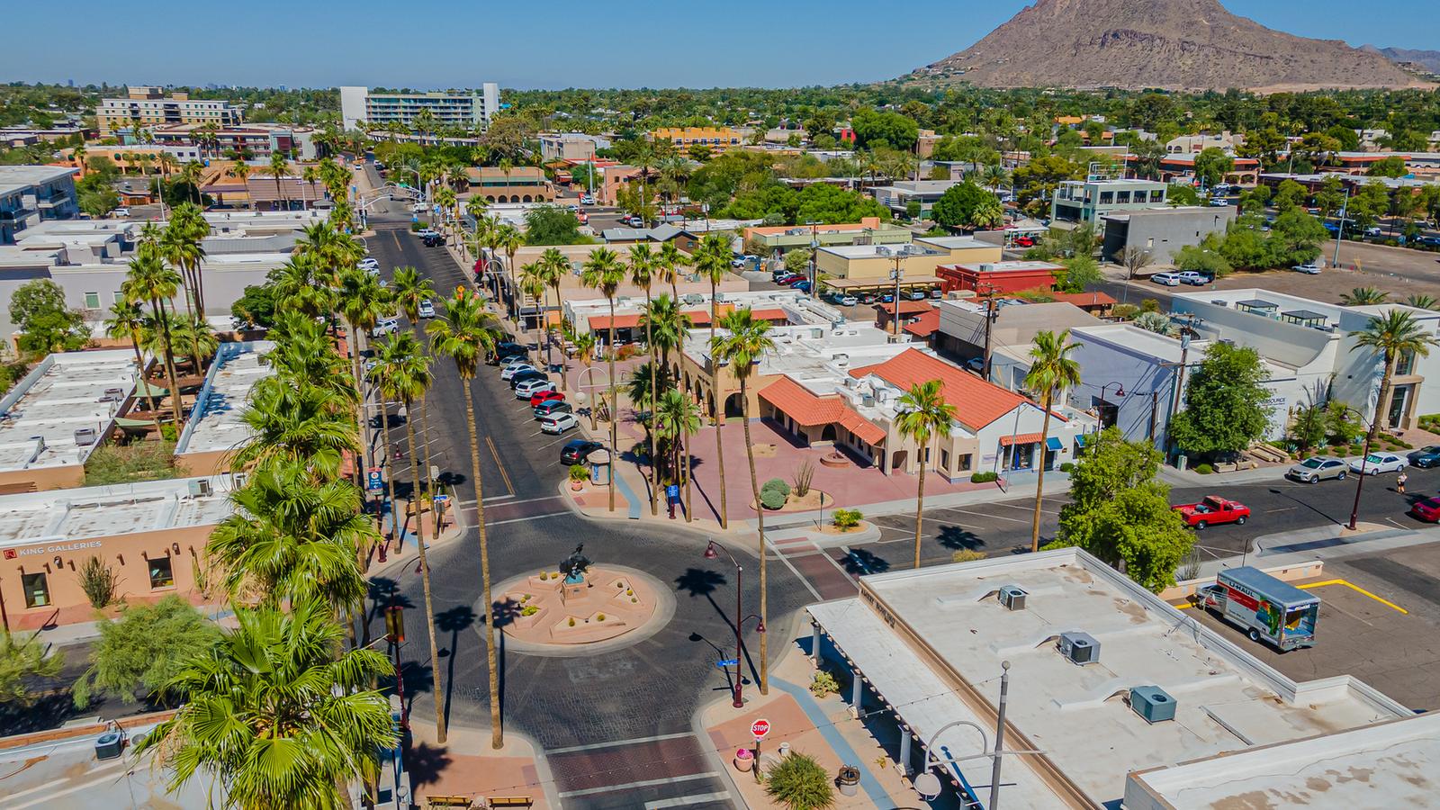 Aerial view of Old Town Scottsdale with Camelback Mountain on the horizon