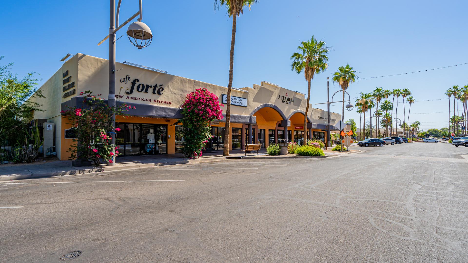 Shops and palm trees along a street in Old Town Scottsdale