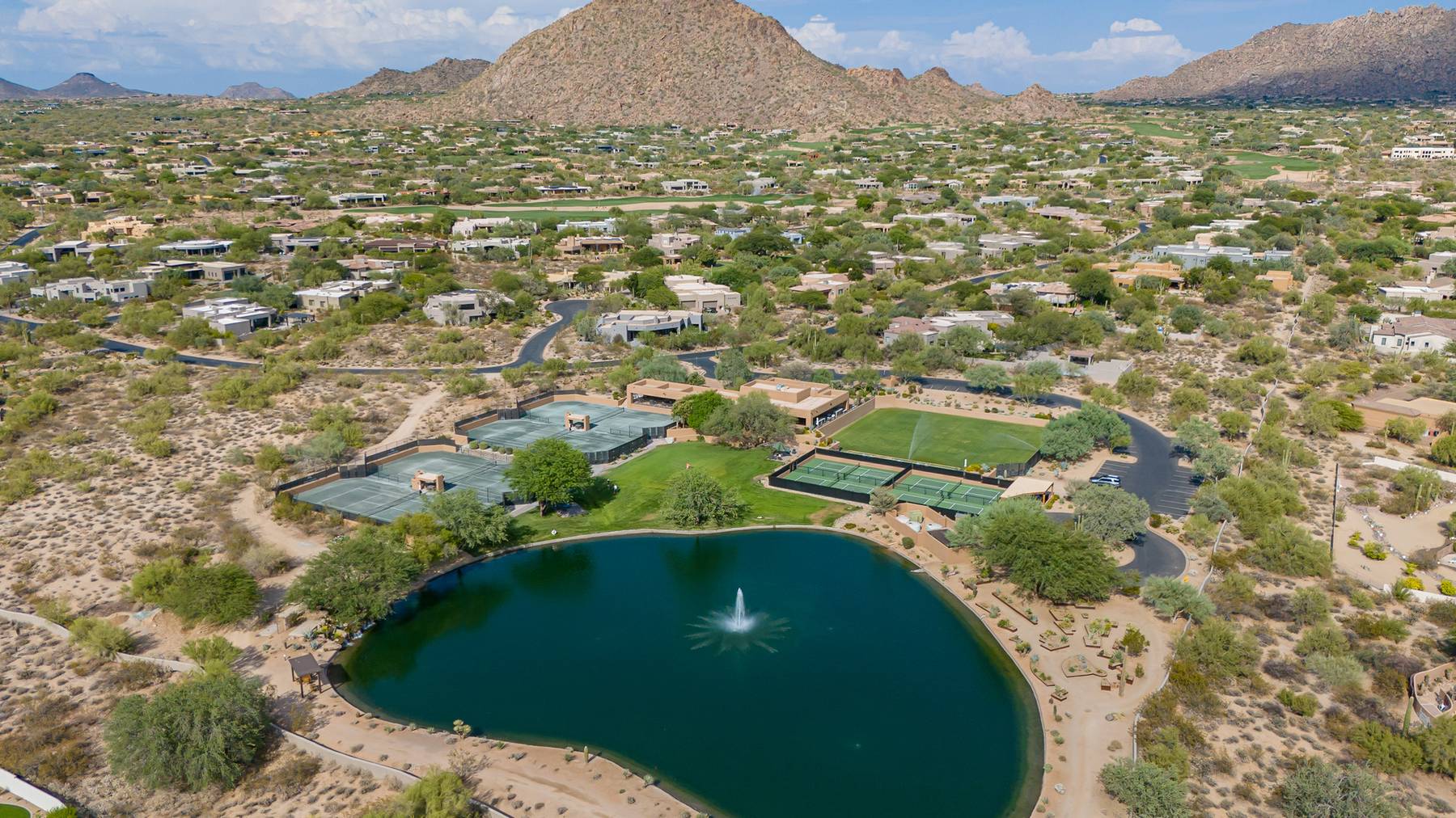 Aerial view of a lake and homes below Pinnacle Peak in north Scottsdale