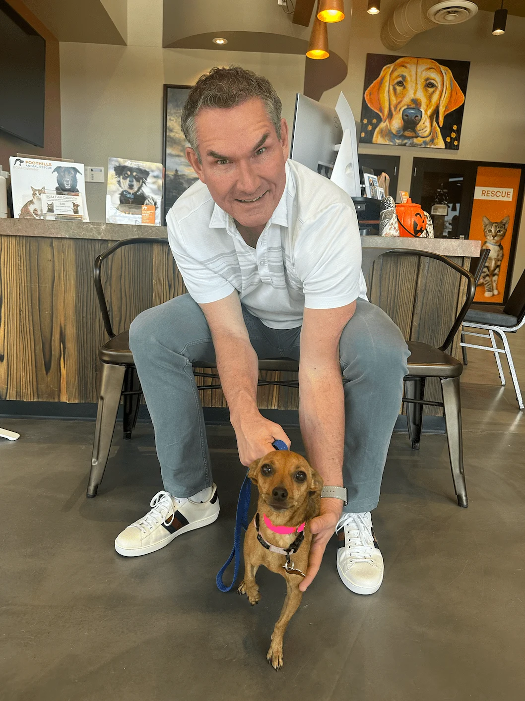 Darren Tackett with an adoptable dog at a Scottsdale rescue