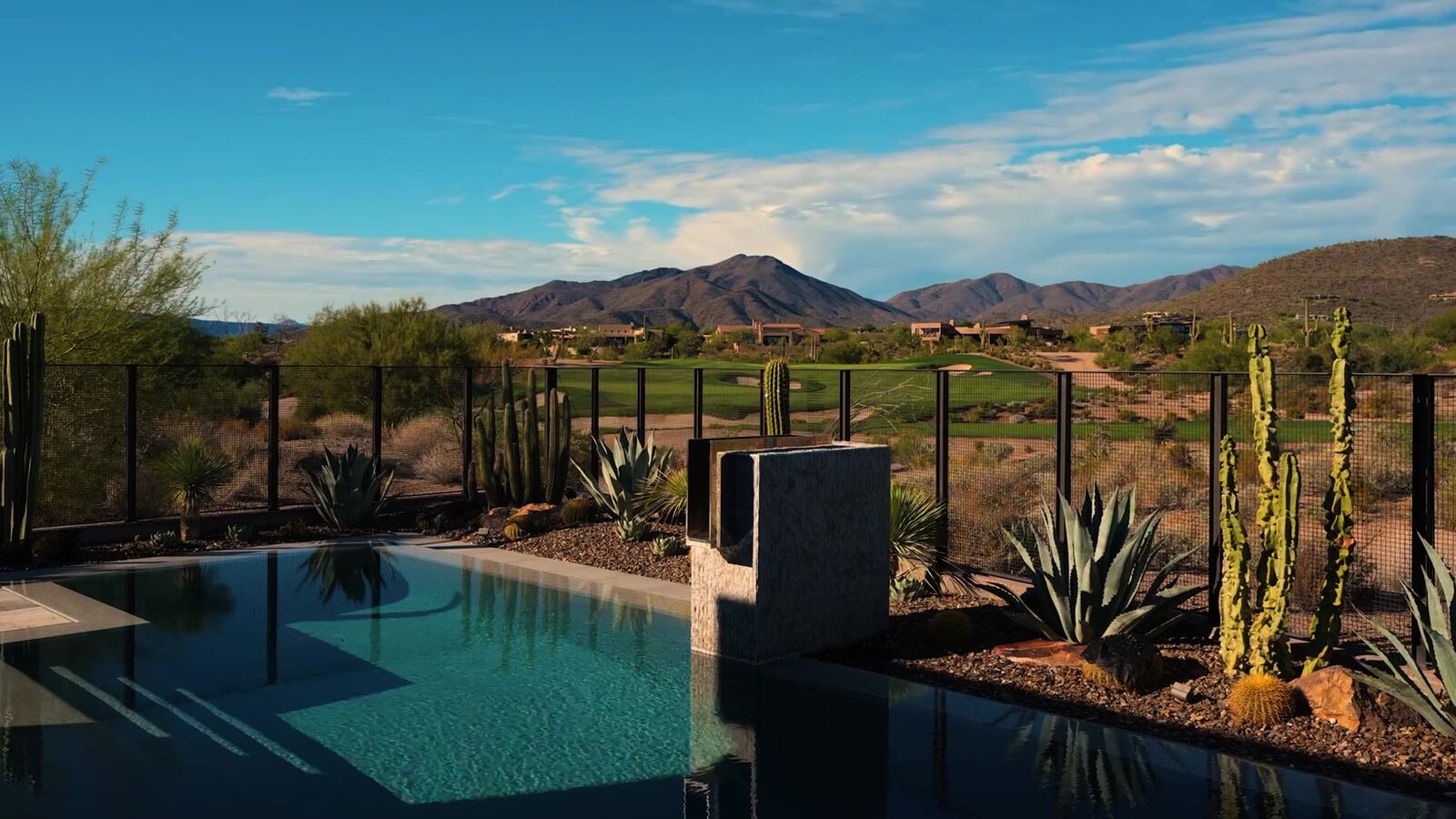 Poolside travertine patio in a private Scottsdale backyard