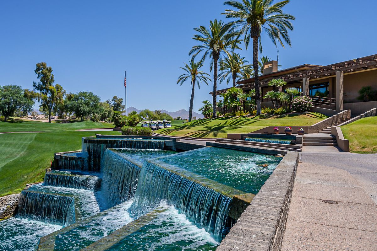 Golf green beside a waterfall feature at Gainey Ranch, Scottsdale