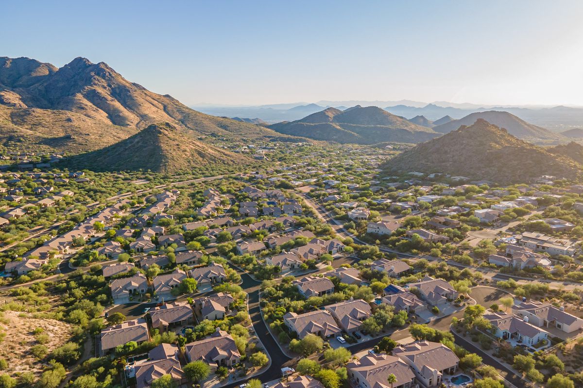 Aerial view of homes beneath the mountains in the Troon foothills, north Scottsdale
