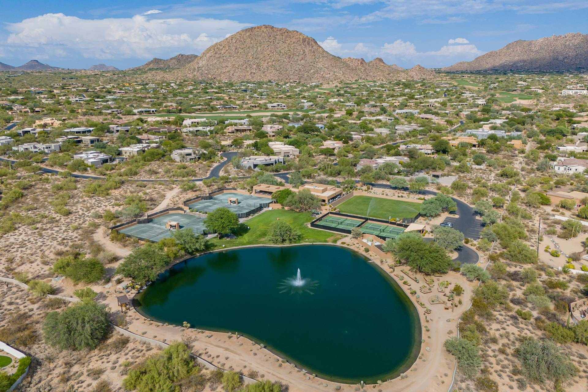 Aerial view of a lake and homes below Pinnacle Peak in north Scottsdale